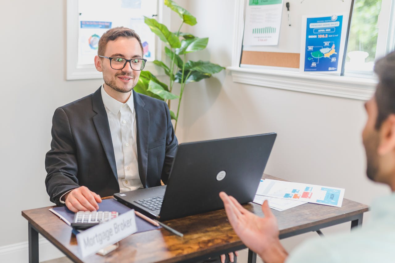 A Mortgage Broker Talking to a Client